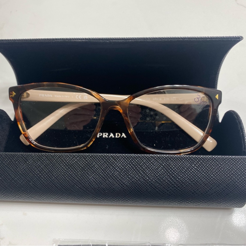 Prada eyeglass frame ladies pink and maroon.  Brand new never used